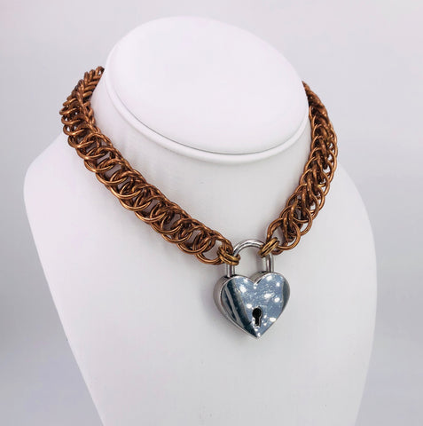 Bronze Statement Collar with Twisted Rings and Heart Lock